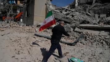 Man carrying Iranian flag
